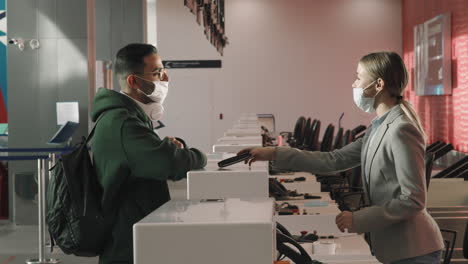 passengers registering at check-in desk
