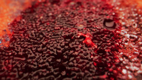 red liquid texture with glitter
