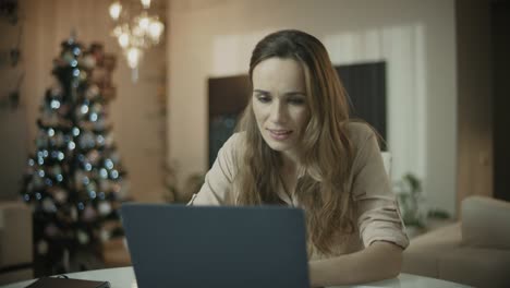 business woman working on laptop computer at christmas holiday