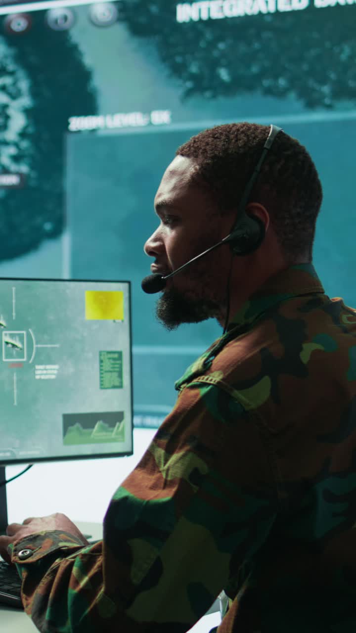 Vertical Video Soldiers in state of the art military control room collaborate on data analysis