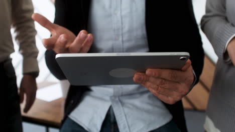 male hands holding a tablet