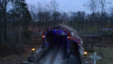 A-Drone-View-of-a-Christmas-Display-of-a-Covered-Bridge-and-Surrounding-Area