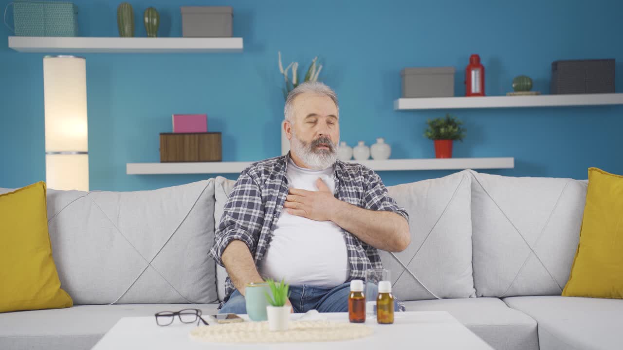 The sick man can't stop coughing.