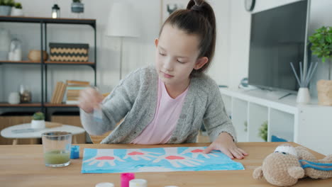 little girl painting at home