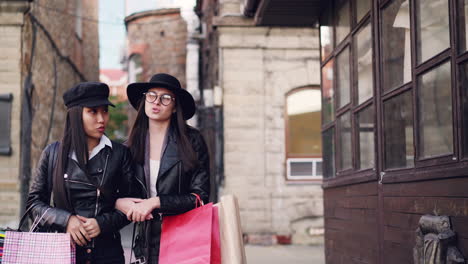 two women shopping in a city street