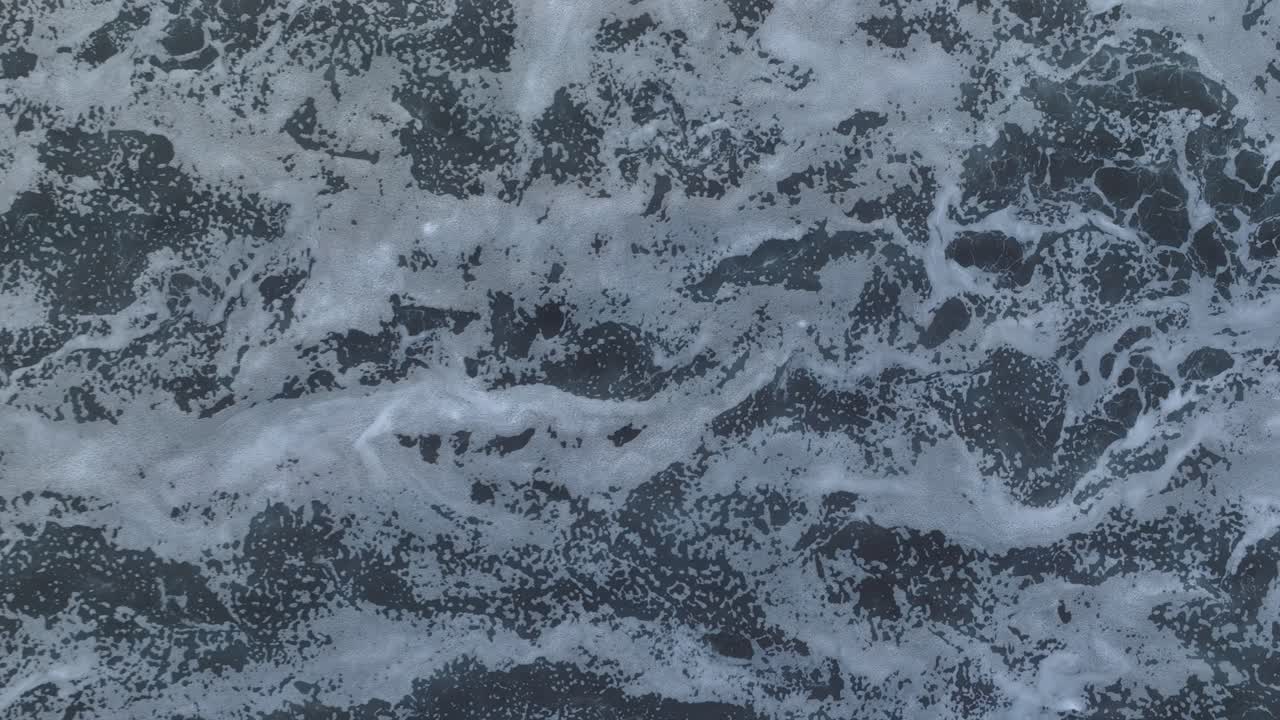 vista aérea de arriba hacia abajo del patrón de onda abstracta el tunco el salvador