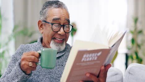 Senior-man,-coffee-and-reading-book-in-living