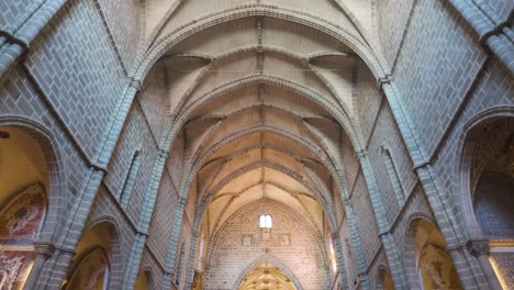 stone nave and ribbed vaults in historic church interior in évora portugal