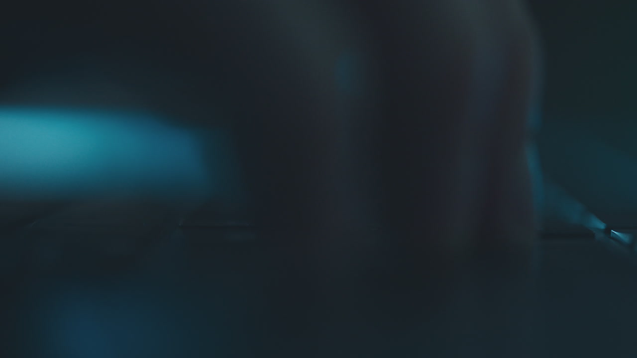 Close-up of a dark keyboard at night