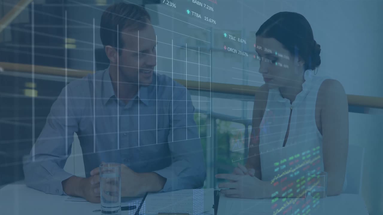 Animation of data processing against diverse businessman and businesswoman discussing over documents