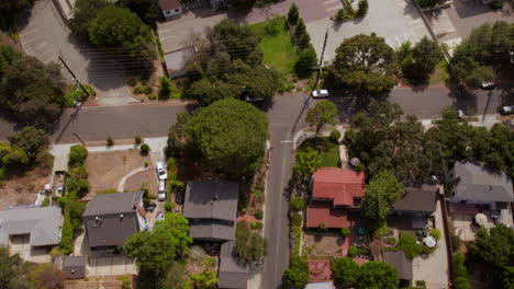 overhead view of street in eagle rock neighborhood with a tilt up to reveal the occidental college campus and hills on the horizon