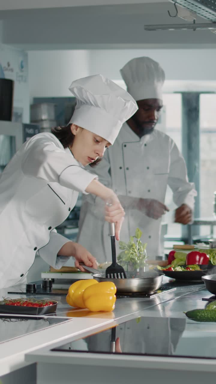 Chefs preparing food in a professional kitchen