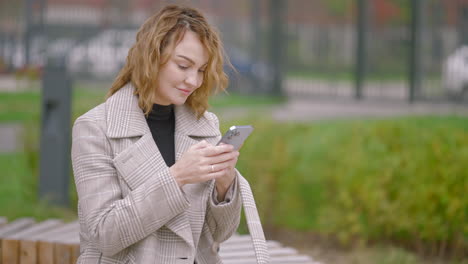 woman using phone outdoors