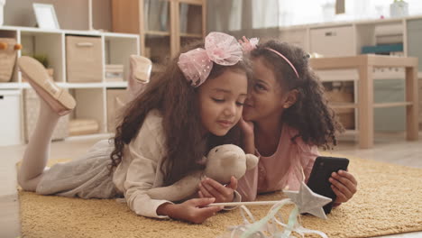 little sisters whispering in ears