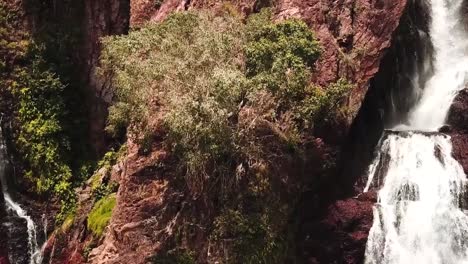 waterfall flowing along cliff face in darwin