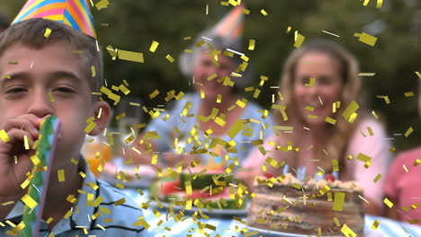 animation of confetti falling over happy family at birthday party