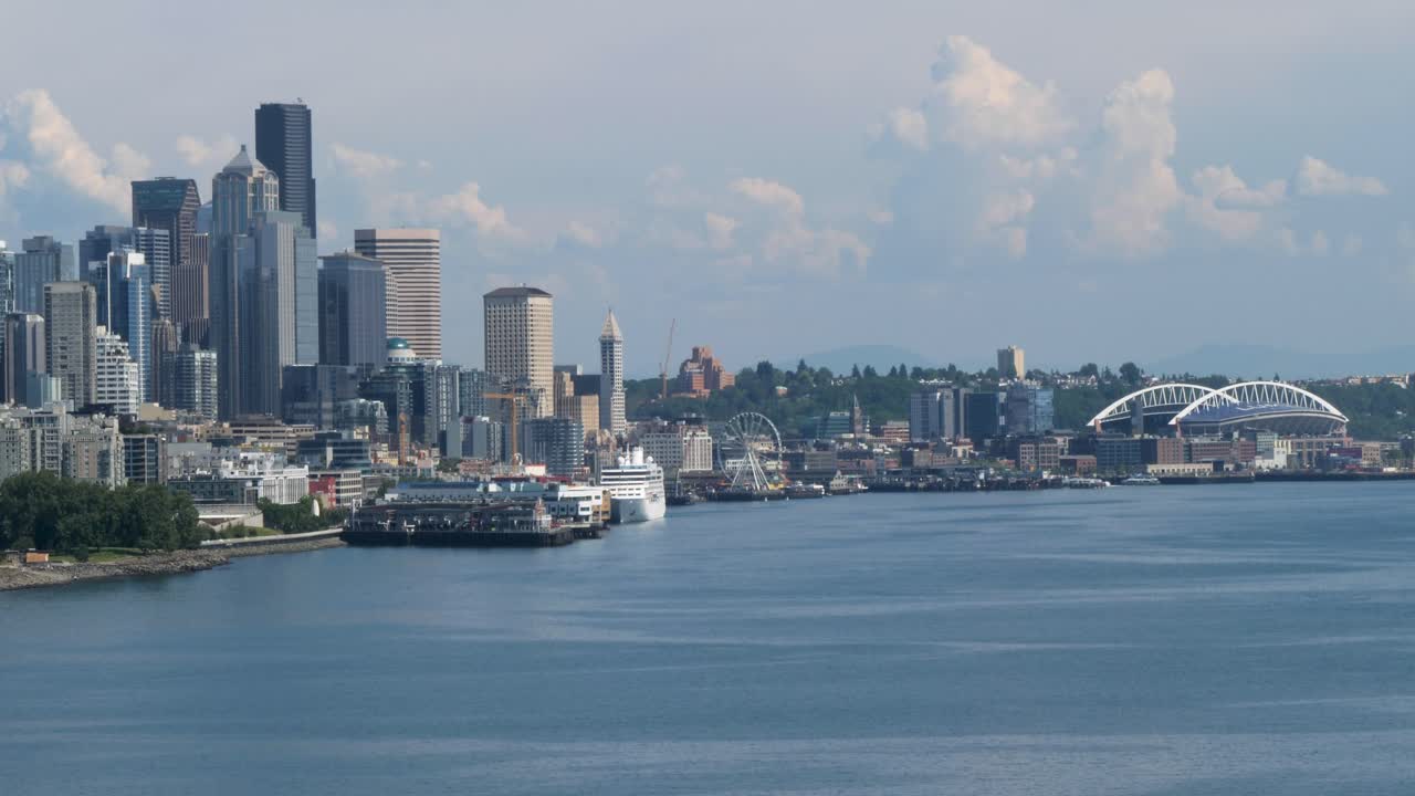 Seattle skyline with Smith tower, Great Wheel and Lumen Field Stadium, viewed from Elliott Bay, Seattle, Washington.