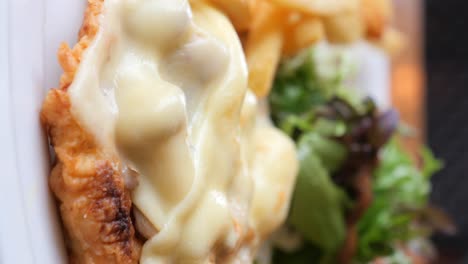 delicious cheese sandwich with fries and salad