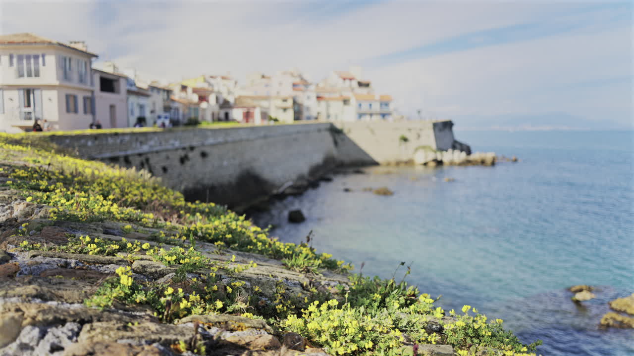 Blurred view of people walking on the coast of Antibes, France