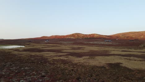 Holyday-cottages-on-a-mountain-plateau-at-sunset-in-Southern-Norway