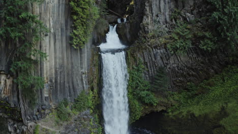 drone shot of toketee falls in umpqua national forest in oregon, rising and tilting down