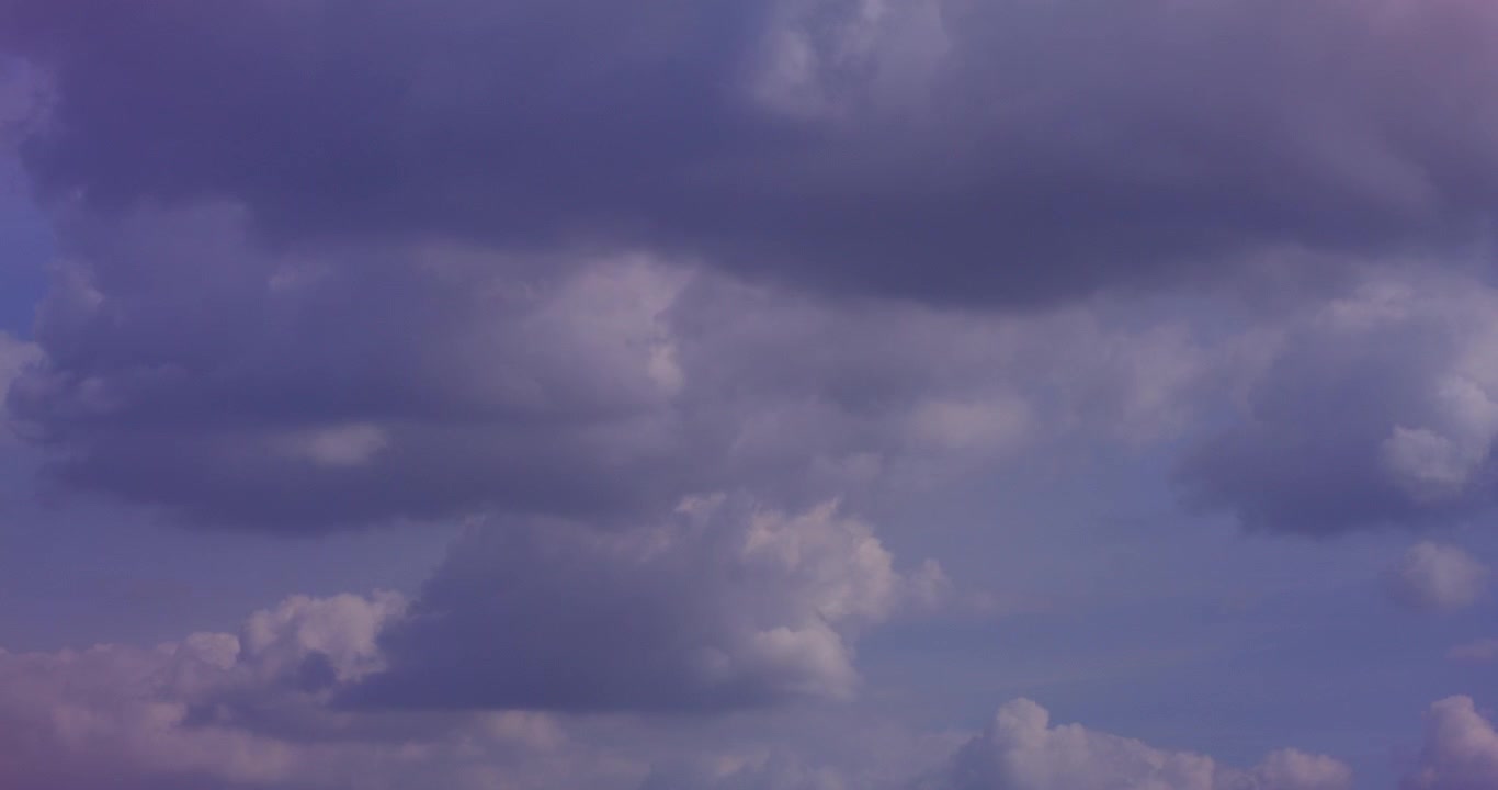 Clouds Drifting Across a Blue and Purple Sky