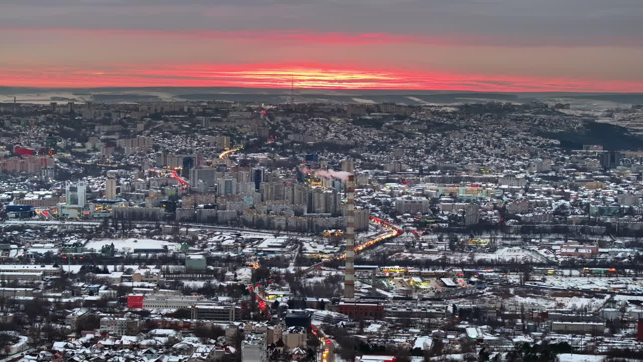Aerial drone view of Chisinau city covered in snow at sunset. Winter in Moldova