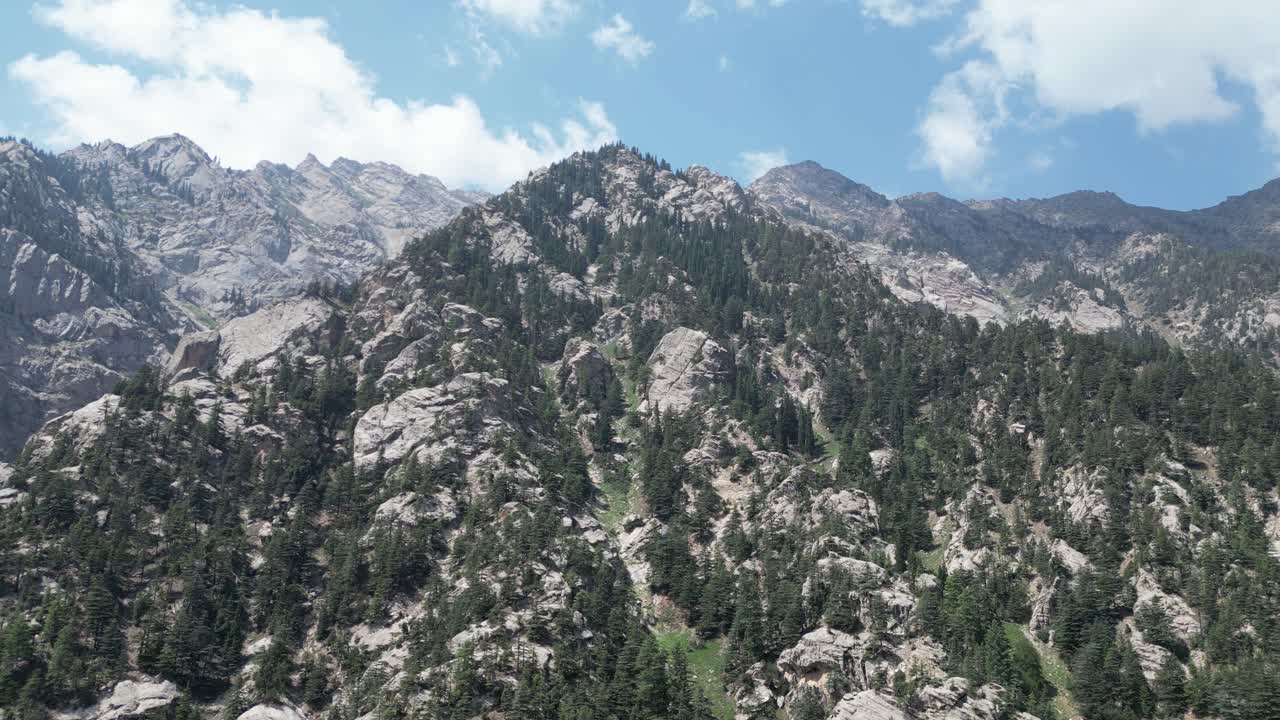 Aerial Drone view approaching vast mountains of Hindu Kush in Nangahar Nuristan, Afghanistan