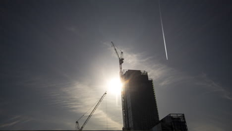 timelapse of city construction and planes flying too and from manchester airport