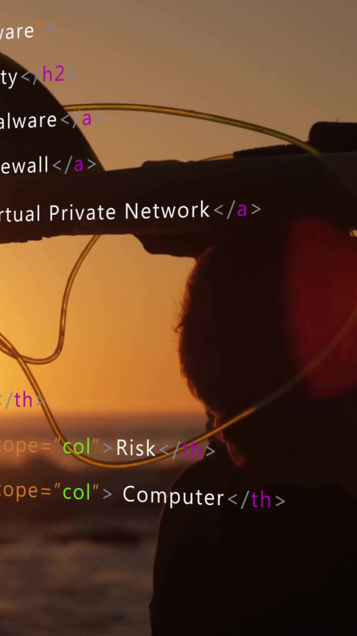 HTML code animation over silhouette of person carrying surfboard at sunset