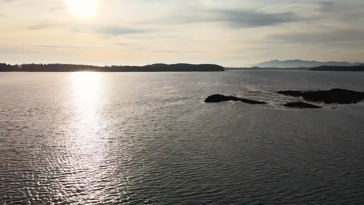 Drone shot of ocean and mountains