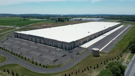 aerial drone view of business park including as station, warehouses, and factories