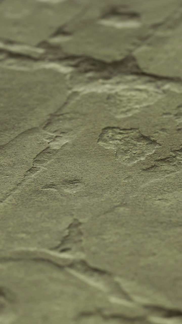 Footprint in a rock formation near a river in the afternoon sun