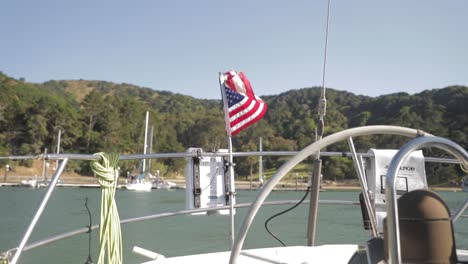 american flag waving from a boat