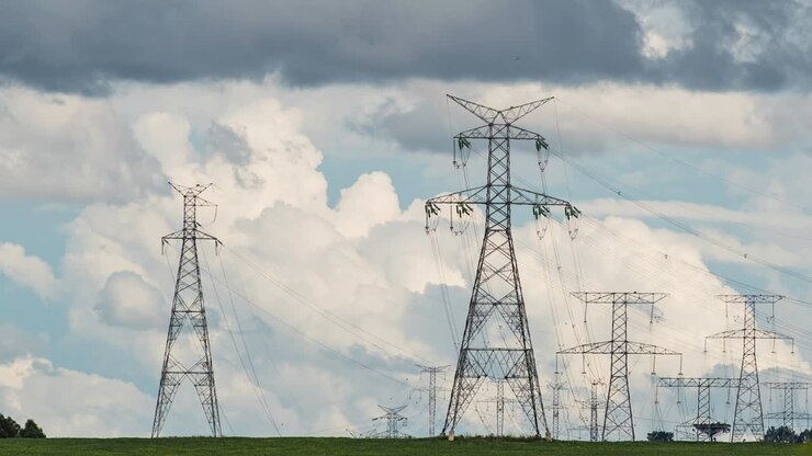 Electricity transmission pylon towers, timelapse showing moving clouds, state of Paraná, Brazil