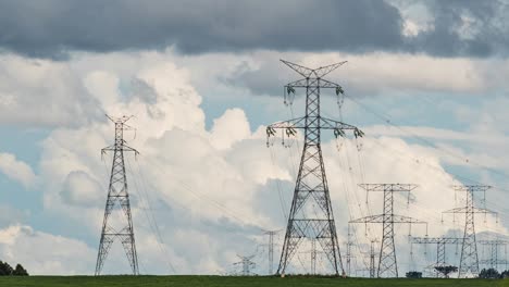 Electricity-transmission-pylon-towers,-timelapse-showing-moving-clouds,-state-of-Paraná,-Brazil