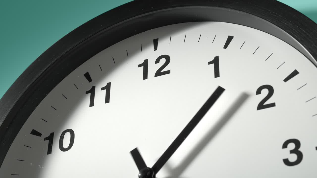 Clock Face on Cyan Blue Aquamarine Celadon Sea-Green Wall in Time Lapse