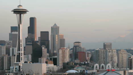 the seattle space needle stands on the left of this timelapse shot of seattle's skyline