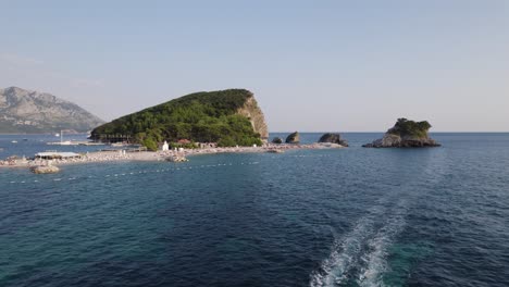 Budva, Croatia: Sveti Nikola Island, boat, Adriatic Sea, and coastal view