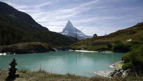 Timelapse-Matterhorn-with-alpine-lake,-Mosjesee-in-Zermatt,-Switzerland,-Europe