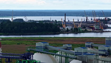 industrial landscape with port cranes at the seaport - drone shot