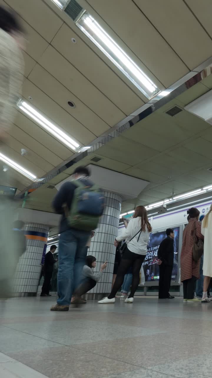 Time Lapse of Commuters Walking on a Busy Subway Station Platform