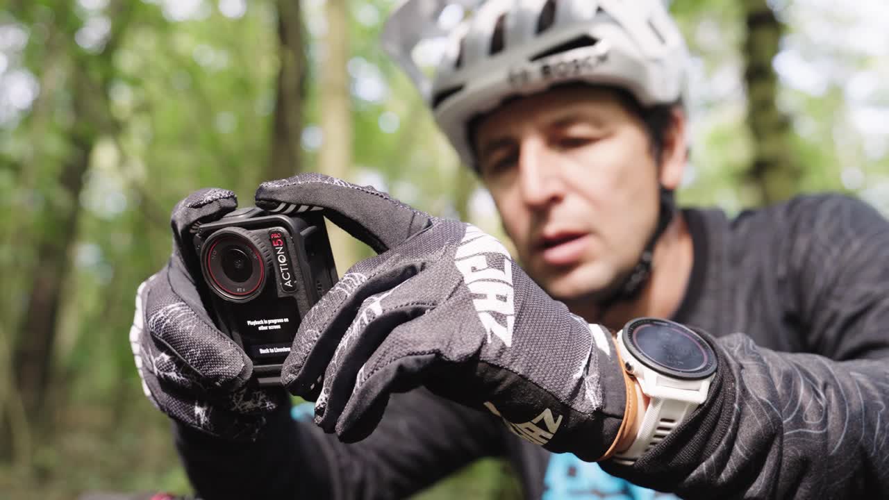 Man Mountain Biking and Recording with Action Camera