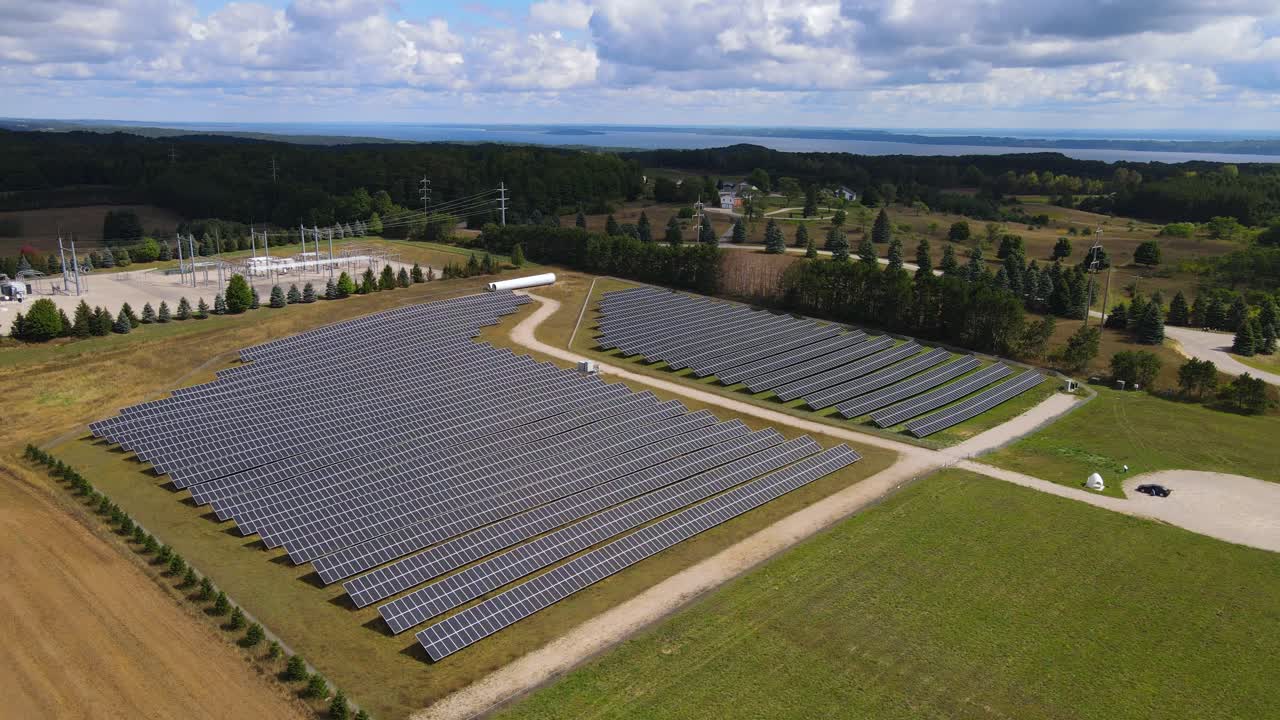 Massive solar panel field in rural Michigan, aerial drone view