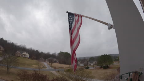 overcast gloomy american suburbs usa flag blowing in wind timelapse