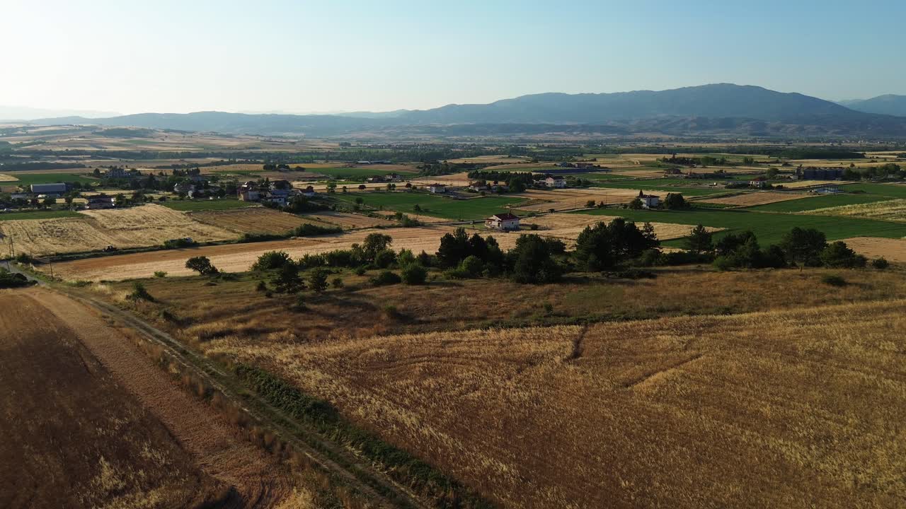 Rural village in northern Greece agriculture hay grain fields nature aerial drone landscape