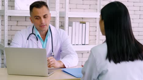 doctor in professional uniform examining patient at hospital