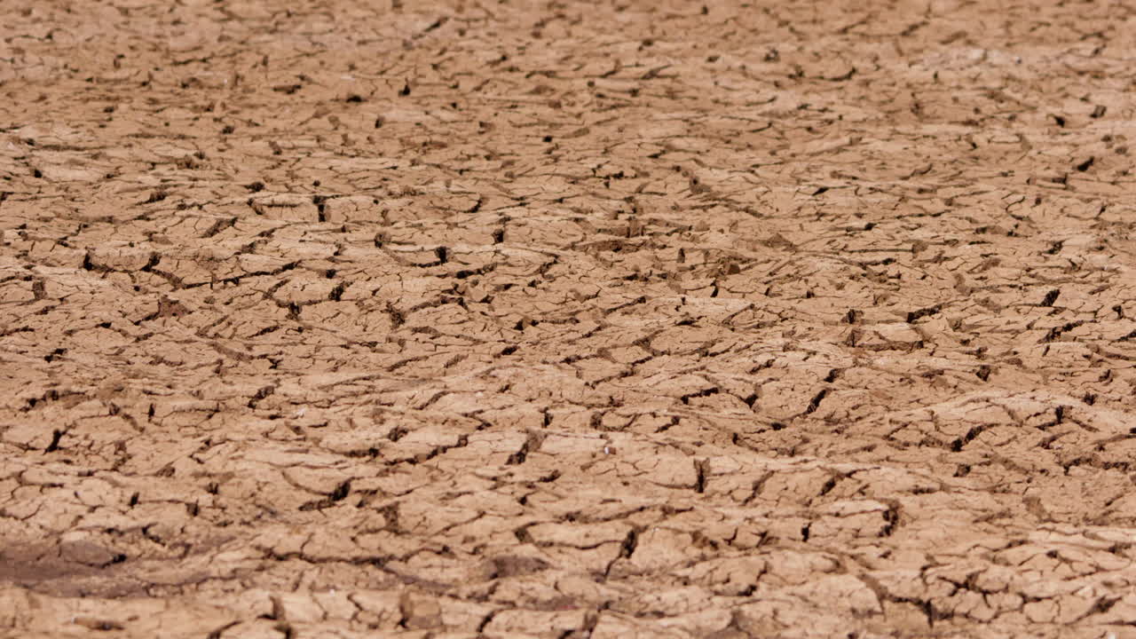 Wide shot of cracked ground on a hot afternoon in Kenya