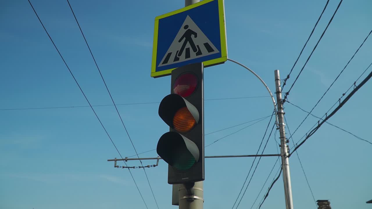 A Blue And Yellow Colored Pedestrian Crossing Signage On The Post. -closeup shot