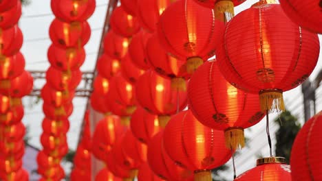 rows of hanging red lanterns for chinese new year, close up